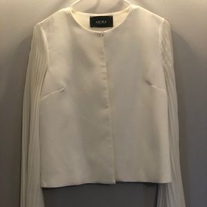 Cape style jacket with pleated sleeves